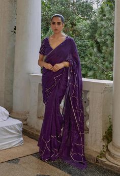 Add a splash of festivity to your wardrobe with the vibrant Titli Saree. Crafted from lightweight linen gauze fabric in bold hues of fuchsia and purple, this saree is perfect for the festive season. Adorned with intricate gota work, the Titli Saree ensures you stand out with its playful colors and shimmering details, making every moment feel as bright and lively as you. MODEL DETAILS Model Name- Mohini  Vitals Height- 5.8 Bust- 34 Waist- 26.5 Hip- 35 Shoulder- 15.5 Fabric: 100% Linen Characteristics of Linen : Hygroscopic All Natural UV Protection Kind On Skin Naturally Breathable Strong Improves With Age Handmade With Love In India By Yell Retail India. Purple Pre-draped Saree With Zari Work For Celebration, Festive Purple Silk Pre-draped Saree, Fusion Style Pre-draped Saree With Zari Work For Diwali, Slub Silk Pre-draped Saree With Pallu For Party, Slub Silk Pre-draped Saree For Party, Fusion Style Pre-draped Saree With Dupatta For Festive Occasions, Purple Tissue Silk Pre-draped Saree With Sheer Dupatta, Party Pre-draped Slub Silk Saree With Pallu, Festive Fusion Style Pre-draped Saree With Dupatta