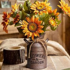 a vase filled with sunflowers sitting on top of a table