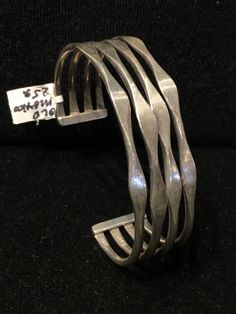 "Old Mexican Sterling Silver abstract modern cuff bracelet with attractive MCM style sculptural positive space-negative space design. Mexico & 925 stamps, plus another one I can't make out, possibly the hallmark of the maker? .75\" wide 5 1/8\" interior circumference plus 1 3/8\" flexible gap 25g 507R - This stunning piece is coming from an exciting relationship with a well known & popular Santa Fe, NM, jewelry gallery. I will be listing many exquisite pieces, some at lower prices than t Modern Adjustable Open Band Bracelets, Modern Adjustable Cuff Bracelet With Open Band, Modern Sterling Silver Bangle, Modern Jewelry With Unique Design And Open Band, Adjustable Sterling Silver Cuff Bracelet In Contemporary Style, Modern Adjustable Sterling Silver Bracelet, Adjustable Modern Sterling Silver Bracelet, Adjustable Modern Open Band Bracelets, Modern Adjustable Open Band Bracelet