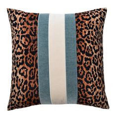 a leopard print pillow with blue and white stripes on the front, and an animal print stripe