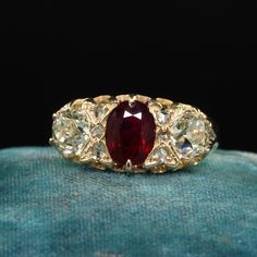 Beautiful Antique Victorian English 18K Gold Burma Ruby Diamond Three Stone Ring - GIA . This gorgeous antique Victorian English ruby and diamond ring is crafted in 18k yellow gold. The ring features a natural Burmese ruby that is unheated in the center and comes with a Lotus Gem report. The sides are gorgeous old European cut diamonds that come with a GIA report. The ring has small rose cuts in between the diamond and ruby and is in great condition. Item #R1994 Metal: 18K Yellow Gold Weight: 3.4 Grams  Size: 8 1/2 Ruby: 1.07 ct - Burma / NO HEAT -  Lotus # 5564-1786  Side Diamond: .82 ct - GIA # 2231197271 Color: S - T Clarity: VS2 Side Diamond: .77 ct - GIA # 2231197275 Color: S - T Clarity: SI2 Measurements: Top of the ring measures 9.33 mm wide and band measures 2.84 mm wide. Measureme Gold Ruby Ring With 17 Jewels For Wedding, Heirloom Yellow Gold Cluster Ring With Gemstone, Victorian Gold Cluster Ring With Gemstone, Antique Yellow Gold Cluster Ring With Gemstone, Antique Yellow Gold Jewelry With Rose Cut Diamonds, 14k Gold Diamond Ring With Rose Cut For Marriage, Antique Yellow Gold Ruby Ring, Hallmarked Yellow Gold Ruby Ring For Wedding, Antique Ruby Ring In Yellow Gold