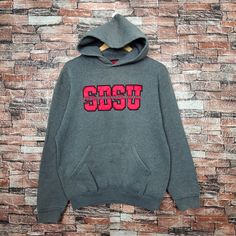 Vintage Distressed San Diego State University Sweatshirt San Diego Hoodie San Diego Pullover Embroidery Logo Gray Color Men's M Label : Black Label Collection Size : M(refer the measurement) Made In USA Materials from 50% Cotton 50% Polyester Used Item With Condition 5/10 Refer Picture. Distressed - Stain and Holes. Lay Down Flat Measurement : - Width (armpit to armpit) and: 22 Inches - Length (shoulder to end of garment): 25 Inches We are selling used clothing with good condition. DO NOT EXPECT the item is like new condition. Shipping: DHL/FEDEX EXPRESS with TRACKING NUMBER. Track and Trace http://www.dhl.com http://www.fedex.com Parcel will be arrive within 3-6 business days or more due to location and custom clearing. Please PROVIDE your PHONE/CONTACT NUMBER for SHIPPING/DELIVERY purpos Streetwear Long Sleeve Hoodie With Letter Embroidery, Long Sleeve Hoodie With Letter Embroidery For Streetwear, Gray Long Sleeve Varsity Hoodie, Fleece Hoodie With Letter Embroidery And Long Sleeves, Long Sleeve Fleece Hoodie With Letter Embroidery, Fleece Hoodie With Letter Embroidery, Sports Season Hoodie With Embroidered Logo, College Hoodie With Letter Embroidery And Long Sleeves, College Hoodie With Letter Embroidery