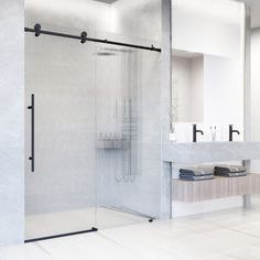 a bathroom with a walk in shower next to a sink