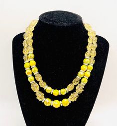 HOBE' Vintage Signed Yellow Green & Glass & Ice Cube Beaded Necklace. Double strands of iridescent green and yellow beads with pale yellow Lucite ice cube beads. In excellent vintage condition with minimal age appropriate wear. The shortest strand is 17 inches long and longest strand is 19 inches long. Beads are strung on chains. Has secure hook and dangle clasp. Signed on reverse Handmade Double Strand Yellow Necklace, Handmade Yellow Double Strand Necklace, Yellow Double Strand Beaded Necklace, Adjustable Yellow Single Strand Beaded Necklaces, Adjustable Yellow Single Strand Beaded Necklace, Adjustable Single Strand Yellow Beaded Necklaces, Adjustable Single Strand Yellow Beaded Necklace, Adjustable Yellow Multi-strand Beaded Necklace, Yellow Multi-strand Polished Beads Jewelry