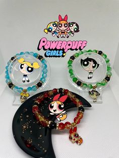 Handmade Powerpuff girls bracelets 🌟 ~ beaded by me, please handle with care. ~Extremely durable (All bracelets are double banded) ~Perfect gift for friends 🫶🏾 ~ more on my instagram @braceletsbychi Green Novelty Bracelets With Round Beads, Themed Handmade Beaded Bracelets, Themed Round Beaded Bracelets For Friendship, Themed Handmade Beaded Bracelets With Round Beads, Handmade Themed Beaded Bracelets, Handmade Themed Beaded Bracelets With Round Beads, Themed Green Beaded Bracelets For Gifts, Themed Green Beaded Bracelets As Gift, Green Themed Beaded Bracelets As Gifts