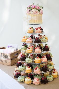 a tower of cupcakes on a table