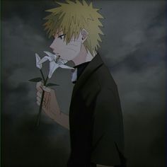 an anime character with blonde hair holding a flower in front of a dark sky background