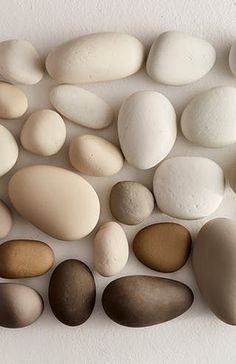 several different types of rocks arranged on a white surface