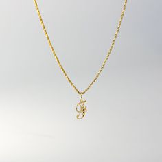 A timeless piece that will never go out of style. This 14K gold calligraphy pendant is the perfect and most stunning way of keeping a name close to your heart. We handmade each piece so you can assure you're getting a one-of-a-kind pendant that is not like any other. This 14K solid gold letter pendant is flawlessly crafted to look super chic and elegant around your neck. Pair it with a nice gold chain and wear it with almost all of your outfits. The piece is such a versatile lettering necklace. F Necklace, F Initial, G Necklace, G Initial, Gold Letter Pendants, Initial F, Initial G, Crystals Necklace, Gold Calligraphy