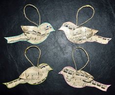 three bird ornaments made out of sheet music