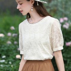 Discover Elegant Simplicity Step into summer with style and grace in our Floral Embroidered Blouse, perfect for those who appreciate the elegance of simplicity combined with chic design. Crafted from a blend of premium polyester and lyocell, this blouse offers a comfortable, breathable fit that keeps you cool on warm summer days. The enchanting floral embroidery adds a touch of nature-inspired beauty, making it a standout piece in any wardrobe. Designed for Versatility Whether you're heading to Beach Gathering, Blouse With Puff Sleeves, Classic Blouses, Middle Aged Women, Style And Grace, Summer Evening, Elegant Floral, High End Fashion, Embroidered Blouse