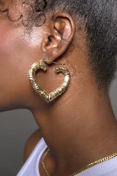 10K Yellow Gold 2" Heart Shaped Bamboo Hoop Earrings Lightweight for all day wear 10K Gold fortified snap bar closure keeps these babies securely closed' Engraved with the affirmation "MM Luvs U" Charged in signature crystal grid and infused with Reiki for generational blessings (click for custom crystal grid charging and intuitively focused Reiki ) Order processing time for in stock items will vary from 2-5 days. Generational Blessings, Gold Bamboo Earrings, Xoxo Jewelry, Y2k Earrings, Dope Jewelry Accessories, Earrings Outfit, Bamboo Hoop Earrings, Small Gold Hoop Earrings, Gold Heart Earring