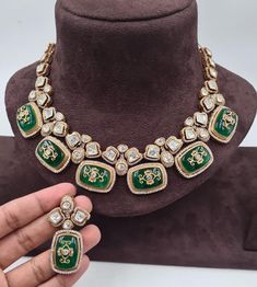 Sabyasachi's Inspired Emerald Polki Necklace is a breathtaking showcase of green Kundan and Polki jewelry, characterized by its exquisite craftsmanship. This necklace embodies the elegance of uncut Polki diamonds and seamlessly combines them with traditional Jadau and Kundan work. The rich green hues of the emeralds enhance the regal allure, making it a timeless piece. This necklace is a harmonious blend of tradition and contemporary aesthetics, celebrating the opulence of Polki and Kundan jewel Elegant Green Kundan Necklace With Meenakari, Green Kundan Necklace For Formal Occasions, Designer Kundan Jewelry For Reception, Formal Green Kundan Necklace, Designer Kundan Necklaces For Festivals, Luxury Kundan Meenakari Necklace For Reception, Designer Kundan Necklace For Weddings And Festivals, Designer Heavy Jewelry For Wedding, Heavy Designer Wedding Jewelry