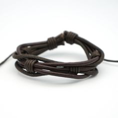 This twisted waxed leather cord bracelet is adjustable to fit most wrists. Available in brown or black. Size: 15mm wide. Masculine Adjustable Braided Bracelets With Leather Strap, Masculine Adjustable Braided Leather Bracelet, Adjustable Brown Leather Braided Bracelet, Adjustable Braided Bracelets With Sliding Knot For Outdoor, Outdoor Adjustable Braided Bracelets With Sliding Knot, Adjustable Braided Bracelet With Sliding Knot For Outdoor, Casual Leather Bracelet With Adjustable Cord, Masculine Everyday Adjustable Bracelets, Adjustable Waxed Leather Bracelet