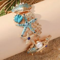 Ocean Beach Shell Wrist Or Ankle Bracelet. New Adjustable. Made With: Alloy, Rhinestones, Pearls. Toggle Clasp. Size: 8.25 Inches In Length. Starfish Jewelry For Vacation, Summer Bracelets With Starfish Charm, Blue Ocean-inspired Jewelry For Vacation, Blue Summer Style Jewelry Gift, Summer Style Blue Jewelry Gift, Starfish Charm Bracelets For Beach Season, Beachy Starfish Jewelry For Vacation, Summer Beach Metal Jewelry, Blue Starfish Charm Jewelry For The Beach