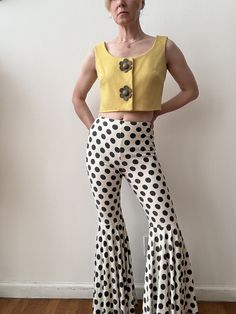 Fantastic grey/blue and white polka dot slim fit high waisted pants. With a back zipper closure and extremely flared leg ends. With a 1970s Eros California label.  Best fit a size extra small 25" waist  32" hip 11.5" rise  29.5" inseam  In good vintage condition, many of the seams have repairs and there are some weak stitches in some seams from wear that may require future repairs as the pants wear, no major flaws, priced as is Green Polka Dot Skirt, Polka Dot Dress Vintage, Yellow Polka Dot Dress, Green Sundress, Polka Dot Jacket, Vintage Polka Dot Dress, Polka Dot Cardigan, Blue Polka Dot Dress, Black And White Romper