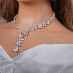 "Very romantic crystal bridal necklace, bracelet and earrings. Gorgeous diamond necklace set for your wedding day! Necklace measures about 16.5\" long. Earrings are about 1 1/2\" long and 1/2\" wide. Matching regular bracelet is measuring: 7\" long and 1/4\" wide or an adjustable bolo matching bracelet is available as well. High quality guaranteed by GlamourBrideUSA! SHIPPING: Standard Shipping: 4-6 business days Priority mail Shipping: 2-3 business days *INTERNATIONAL ORDERS: PLEASE NOTE CUSTOM Elegant Crystal Bridal Necklace, Silver Crystal Jewelry Sets For Brides, Bride's Silver Crystal Jewelry Sets, White Rhinestone Bridal Jewelry, White Cubic Zirconia Bridal Jewelry, Elegant Crystal Jewelry Sets For Anniversary, Dangle Jewelry Sets For Wedding, Elegant Bridal Jewelry With Rhinestones, Dazzling Jewelry Sets With Jewels For Wedding