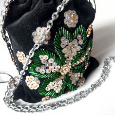 Vintage Shoulder Bag - Black Velvet with Green & Silver Beaded Floral Embroidery Step back in time with this charming vintage shoulder bag, a true statement piece that exudes elegance and whimsy! Key Features: Style: Sweet and classic candy-bag silhouette, perfect for adding a touch of vintage flair to any outfit. Material: Luxurious black velvet adorned with intricate green and silver beaded floral embroidery. Details: The opening of the bag is beautifully finished with zigzag trim and matching Classic Candy, Vintage Shoulder Bag, Shoulder Bag Black, Candy Bags, Clutch Handbag, Vintage Charms, Silver Beads, Floral Embroidery, Black Velvet