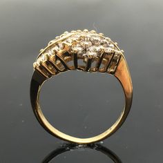 14K Diamond Cluster Ring METAL: 14K Yellow Gold TOTAL WEIGHT: 4.1g DIAMONDS: Round Brilliant Cut and Baguette Diamonds COLOR: H/I CLARITY: SI1 TOTAL WEIGHT: 1.00 ct SIZE: Ladies size 5-9. Please indicate your ring size at checkout. DESCRIPTION: Vintage style diamond cluster ring. The ring is yellow gold with round and baguette diamonds. The top width is 11.8mm and a height of 6.2mm. Luxury Gold Cluster Diamond Ring, Yellow Gold Cluster Ring With Brilliant And Baguette Cut, Yellow Gold Cluster Ring With Baguette And Brilliant Cut, Heirloom Yellow Gold Baguette Cut Cluster Ring, Gold Art Deco Baguette-cut Ring, Art Deco Gold Baguette Cut Ring, Gold Art Deco Baguette Cut Ring, Gold Cluster Ring With Baguette Cut And Prong Setting, Gold Cluster Diamond Ring In 14k