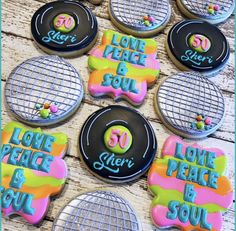 decorated cookies with the words love, peace, and soul on them are laid out