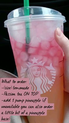 a person holding up a cup with pink liquid and a green straw in it that says, what to order