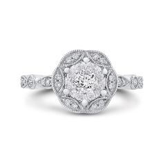 an antique style diamond engagement ring in white gold