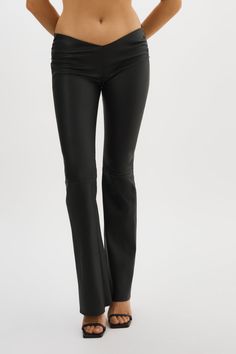 An elevated version of the classic leather trouser, the NADDA low rise leather pants feature a dipped front, ruching at the hips and a flared hem to flatter your shape. Think of them as an effortless foundation for so many outfits. Elegant Flare Leather Pants, Elegant Flared Leather Pants, Elegant Flare Leather Pants For Fall, Fitted Flare Leather Pants For Work, Elegant Flared Leather Pants For Night Out, Leather Flare Bottoms For Work, Flared Leather Bottoms For Work, Flare Leather Bottoms For Work, Chic Flared Leather Pants