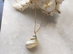 Elegant seashell necklace made with real shell. These necklace are perfect gift for ocean lover and those who love to keep a bit of sea close to them . Pick your necklace style and necklace length. Choose 12 inches or 12-14 inches if you would like to wear this necklace as a choker Size of Cowrie shells - As these are natural shell the size may vary from order to order. Style A - between 2.5-3 cm ( not dainty) Style B- between 1.5-1.75 cm ( dainty) Style C- between 1.5-1.75 cm ( dainty) This ite Mother Of Pearl Shell Necklace As Gift, Mother Of Pearl Shell Necklace For Gift, Ocean-inspired Mother Of Pearl Shell Necklace For Gift, Ocean-inspired Mother Of Pearl Shell Necklace As Gift, Ocean-inspired Mother Of Pearl Shell Necklace Gift, Ocean-inspired Shell Necklace As Gift, Ocean-inspired Shell Necklace For Gift, Ocean-inspired Shell Necklace Gift, Ocean-inspired Abalone Shell Necklace