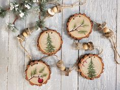 christmas ornaments made out of wood with pine trees on them