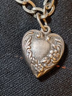 "FREE SHIPPING- Vintage 1/2\" Long Sterling Silver Puffy Heart Charm for Charm Bracelet. Heart with Flowers and Open Space for an Initial. Very Good Condition! Please review all images and contact with any questions FREE SHIPPING FOR ALL ORDERS GOING TO THE CONTINENTAL U.S.A (LOWER 48 STATES) ALL PURCHASES DESTINED FOR ALASKA OR HAWAII WILL INCUR SHIPPING CHARGES PLEASE SEE OUR PHOTOS ABOVE FOR DETAIL & CONTACT US WITH ANY QUESTIONS YOU MAY HAVE." Vintage Nickel-free Heart Bracelet As Gift, Vintage Nickel-free Heart Bracelet Gift, Nickel-free Vintage Heart Bracelet As Gift, Vintage Heart Charm Bracelet With Lobster Clasp, Vintage Adjustable Heart Charm Necklace, Vintage Heart Bracelet With Charm For Valentine's Day, Vintage Heart-shaped Charm Bracelet For Valentine's Day, Vintage Heart Bracelet For Valentine's Day Anniversary, Vintage Heart Charm Bracelet For Valentine's Day