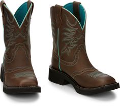 The leather exterior is tastefully accented by a vivid delicate stitch pattern, outer seam, and interior. This cowgirl boot is made for comfort as much as it's made for style with a wide square toe, rubber outsole, and J-Flex Comfort System� insoles with Women's Work Boots, Pattern Outer, Tony Lama Boots, Womens Cowgirl Boots, Rugged Boots, Ostrich Boots, Womens Work Boots, Cowgirl Boot, Steel Toe Boots