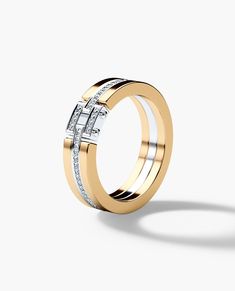 two tone gold wedding ring with diamonds on the outside and inside, set against a white background