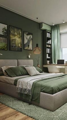 a bedroom with green walls and pictures on the wall above the bed, along with a desk