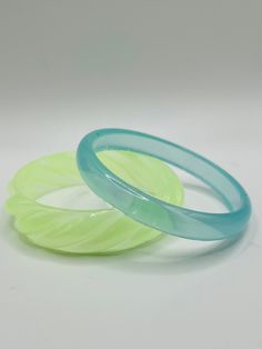 "These gorgeous resin bracelets are both eye catching and lightweight. Layer them with your favorite bangles, or alone to add a pop of color to the your favorite outfit, make this matching set your favorite pair today! 2 1/2\" diameter Color: Translucent Matcha Green and Ocean Blue listing is for (2) bracelets" Trendy Plastic Bangle Jewelry, Green Plastic Bracelet Jewelry, Trendy Plastic Bangle Bracelets, Green Plastic Bracelet, Jelly Bracelets, Statement Bracelets, Italian Bracelet, Resin Bracelet, Chunky Bracelets