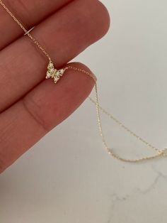 "14K Yellow Gold Gold Butterfly Necklace 16\"+2, Dainty Butterfly Chain, Minimalist Necklace, Layering Necklace, Butterfly Chain, Butterfly ♦ Materials: 14K Yellow Gold, Cubic Zirconia ♦ Available colors: Yellow Gold ♦ Necklace measurements: 16\" with a 2\" extender, for a total length of 18\". The chain is 1MM wide. The charm is 5MM -------------------------------------------------- ♦ -------------------------------------------------- MATERIALS All chains and pendants are made of 14K Solid Gold M Necklaces, Minimalist Jewelry Aesthetic, 14k Gold Butterfly Necklace, Dainty Butterfly Necklace, Gold Dainty Necklace, Gold Butterfly Necklace, Necklace Measurements, Gold Minimalist Jewelry, Butterfly Chain