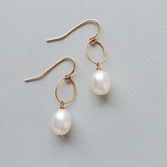 Choice of Earwire: Hook, Metal: 14kt Gold Fill Delicate Oval Pearl Drop Jewelry, Elegant Oval Earrings With Ear Wire, Yellow Gold Oval Pearl Earrings, Classic Oval Pearl Earrings With Ear Wire, White Oval Pearl Earrings With Pearl Charm, White Oval Pearl Earrings With Charm, Oval Pearl Drop Jewelry, Formal Oval Earrings With Pearl Charm, Elegant Oval Jewelry With French Hook