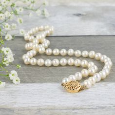 "This classic take on the pearl necklace was inspired by a cherished family heirloom. This necklace features gorgeous round freshwater pearls, which are individually hand-knotted on white silk and then finished with an elegant, vintage-style filigree box clasp available in gold plated, silver plated, sterling silver, 14K gold filled, and 14K solid gold options. **Why invest in knotted pearls? A knotted pearl necklace will hang more evenly and the pearls will not rub against one another and wear Pearl Necklace Classic, Wedding Pearls, Vintage Pearl Necklace, Classic Pearl Necklace, Real Pearl Necklace, Pearl Necklace Vintage, Pearl Necklace Wedding, Vintage Pearl, Necklace Wedding