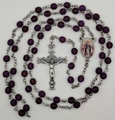 Handcrafted, heirloom quality etched purple Our Lady of Grace rosary made with 6mm rich etched purple round Czech glass druk beads, 2mm silver stainless steel accent beads, an ornate oxidized silver metal tulip crucifix, and a full-color, two-sided Our Lady of Grace centerpiece.  All the other materials are 304 stainless steel for strength and durability. All of the rosaries and chaplets that are listed are handcrafted by me nearly every day.  Follow my shop to keep up with what's new! A rosary Purple Rosary With 8mm Round Beads, Purple Rosary With 8mm Beads, Handmade Adjustable Purple Rosary, Purple Beaded Rosary As Gift, Rosary Prayer Guide, Our Lady Of Grace, Bead Rosary, Rosary Prayer, Czech Beads