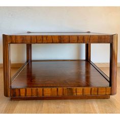 a wooden table sitting on top of a hard wood floor