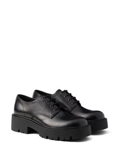 black calf leather smooth grain matte finish debossed logo to the side front lace-up fastening chunky rubber lug sole leather insole Debossed Logo, Derby Shoes, Lug Sole, Calf Leather, Black Shoes, Derby, Prada, Grain, Lace Up