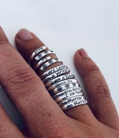 "These inspirational stacking rings are adjustable and solid sterling silver. The wording on the rings is small, about 2mm tall, that way you can stack several rings together on one finger. Whether you choose the inspirational phrase \"No Matter What\", or \"I am Enough\", or the name/date of a loved one you're sure to have a reminder of what's most important to you. These make great anniversary gifts, great gifts for mother or grandmother, or anyone in your life. The adjustable size makes it pe Mantra Ring, Fingerprint Ring, Hand Stamped Ring, Fingerprint Necklace, Handwriting Necklace, One Finger, Gifts For Mother, Great Anniversary Gifts, Stamped Rings