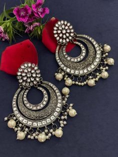 Step out in style with this beautiful oxidised silver plated earrings, which have been given a drop designer dangler perfectly designed. It will add bling to your look. This earring will go well with any of your ethnic outfits. Elegant Oxidized Chandbali Hoop Earrings, Metal Chandbali Chandelier Earrings With Intricate Design, Metal Chandbali Bridal Earrings, Metal Chandbali Danglers With Meenakari, Metal Meenakari Chandbali Danglers, Chandbali Meenakari Danglers In Metal, Metal Chandbali Chandelier Earrings, Intricate Metal Chandbalis Drop Earrings, Metal Chandbali Danglers With Intricate Design