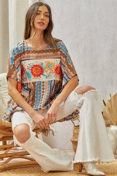 Floral Poncho Top This Woven Poncho Top features delicate floral embroidery across the front. The neckline is round and the fit is flowy and loose, making it a comfortable and stylish choice. A S/M fits a bust of 34-36" (a size 4-8) and a M/L fits a bust of 35-38" (a size 6-10). Brand: Savanna Jane Spring Bohemian Crew Neck Blouse, Summer Bohemian Blouse With Batwing Sleeves, Bohemian Batwing Sleeve Blouse For Summer, Multicolor Batwing Sleeve Tops For Spring, Bohemian One-size Blouse For Vacation, Floral Print Crew Neck Blouse For Beach, Floral Print Crew Neck Blouse For Vacation, Vacation Floral Print Crew Neck Blouse, Bohemian Crew Neck Blouse For Vacation