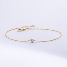 Solitaire Diamond Bracelet in 14K or 18K solid Gold, Bezel Set Dainty Diamond by the Yard Bracelet, Minimalist Bracelet Gift for Women, Graduation Gifts, Gift For Valentine, Gift For Birthday, Gift For Bridesmaid, Wedding Gift For Her ► Adding a customized tiny bar at clasp may be a good idea: https://etsy.me/3cn9OQ5 Material: Solid Gold, real gold (not gold plated or gold filled material) Karat: 14K (585), 18K (750) Gemstone: Genuine Diamond Available diamond options (size mm - weight ct): 1.80 Elegant Gold Chain Bracelet With Bezel Setting, Elegant 14k Gold Chain Bracelet With Bezel Setting, Gold Diamond Bracelet With Birthstone, Elegant Gold Diamond Bracelet With Birthstone, Elegant Gold Diamond Birthstone Bracelet, 14k Gold Chain Bracelet With Bezel Setting, 14k Gold Chain Bracelet With Bezel Setting As Gift, 14k Yellow Gold Chain Bracelet With Bezel Setting, 14k White Gold Bracelet With Single Diamond