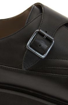 Neat stitching enhances the clean lines of a smooth leather monk-strap shoe grounded by a durable rubber sole. Leather upper and lining/rubber sole Made in Portugal Black Leather Monk Strap Shoes With Brogue Detailing, Black Calf Leather Monk Strap Shoes With Leather Footbed, Calf Leather Monk Strap Shoes For Workwear, Luxury Black Monk Strap Shoes With Buckle, Modern Monk Strap Shoes In Calf Leather For Work, Black Leather Monk Strap Shoes With Leather Footbed, Leather Loafers With Tang Buckle For Work, Calf Leather Shoes With Buckle Closure And Plain Toe, Modern Calf Leather Monk Strap Shoes For Work