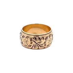 A vintage wedding band.  The band is 10mm wide.  The ring has a hand engraved floral scroll design that continues around the ring with a milgrain detail on the edge. The ring is a size 6 1/4.  This ring cannot be sized. Metal Content Guaranteed 14k gold Weight: 9.3 grams Measurements of Ring 3/8 inches wide at top (10mm) Markings 14K Ornate Engraved Ring For Ceremonial Occasions, Antique Engraved Ring For Wedding, Victorian Engraved Ring For Formal Occasions, Wedding Yellow Gold Stamped Jewelry, Vintage Jewelry With Engraving Option, Ornate Engraved Ring For Anniversary, Vintage Ceremonial Ring With Engraving Option, Heirloom Round Band With Intricate Design, Heirloom Engraved Ring With Intricate Design