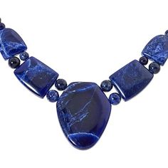 Jay King Sterling Silver Blue Sodalite 18" Necklace Bring out the blue in your eyes or a favorite outfit when you accessorize with this handcrafted, blue sodalite necklace. From Jay King.       Approx. 18"L x 1/4"W with 2-3/4" extender     Drop approx. 1-11/16"L x 1-5/16"W     Stamped .925     Hook closure     Blue sodalite necklace has drape comprised of large, freeform stone flanked by four smaller freeform stones separated by round beads     Round sodalite beads complete necklace   Stone Information       All sizes and weights approximate     Stabilized Blue Sodalite - Freeform (16x20mm to 34x44mm), round (6-8mm); mined in South Africa Handmade Sodalite Round Bead Necklaces, Sodalite Round Beads Jewelry For Healing, Handmade Sodalite Healing Necklace, Blue Sodalite Pendant Necklace, Blue Kyanite Round Bead Jewelry, Sodalite Necklace, Jewelry King, Necklace Stone, Blue Sodalite