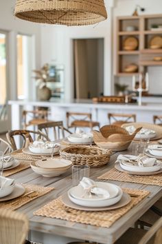 the table is set with dishes and place settings