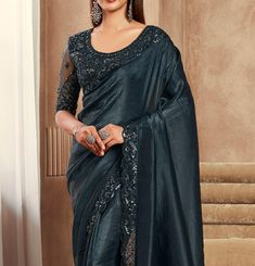 COLOR : Shimmer Peacock Black FABRIC : Saree - Fancy Silk, Blouse - Fancy Silk & Net WORK : Resham Embroidery, Stones, Sequins, Lace BorderOCCASION : Wedding, Engagement, Party Wear, Festival, Sangeet NOTE : The outfit includes blouse and saree only. Petticoat is not included. READY-TO-WEAR : No STITCHING : Available as semi-stitched fabric, can be stitched using standard size option (+$30). Note: There might be a slight color variation due to lighting and flash used during photoshoot. The brigh Formal Festive Pre-draped Saree With Intricate Embroidery, Traditional Embroidered Pre-draped Saree For Formal Occasions, Formal Embroidered Silk Pre-draped Saree, Embroidered Pre-draped Saree For Formal Festive Occasions, Elegant Embroidered Pre-draped Saree For Formal Occasions, Party Embellished Embroidered Art Silk Fabric, Formal Embroidered Unstitched Saree, Festive Party Wear Blouse With Intricate Embroidery, Wedding Party Wear Blouse With Intricate Embroidery