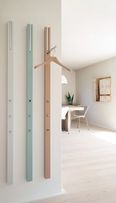 a room with white walls and wood flooring